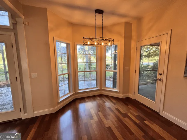 a kitchen with stainless steel appliances granite countertop wooden cabinets stove and a sink