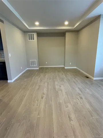 a view of an empty room with closet area