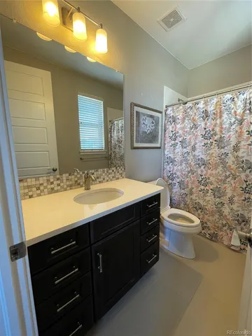 a kitchen with stainless steel appliances granite countertop a sink and a stove