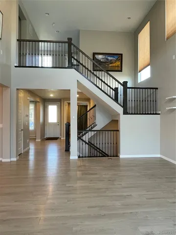 a view of staircase with white walls and windows
