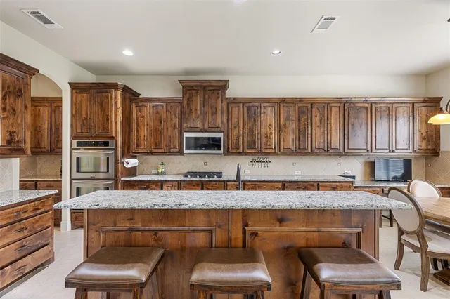 a kitchen with a sink cabinets and window