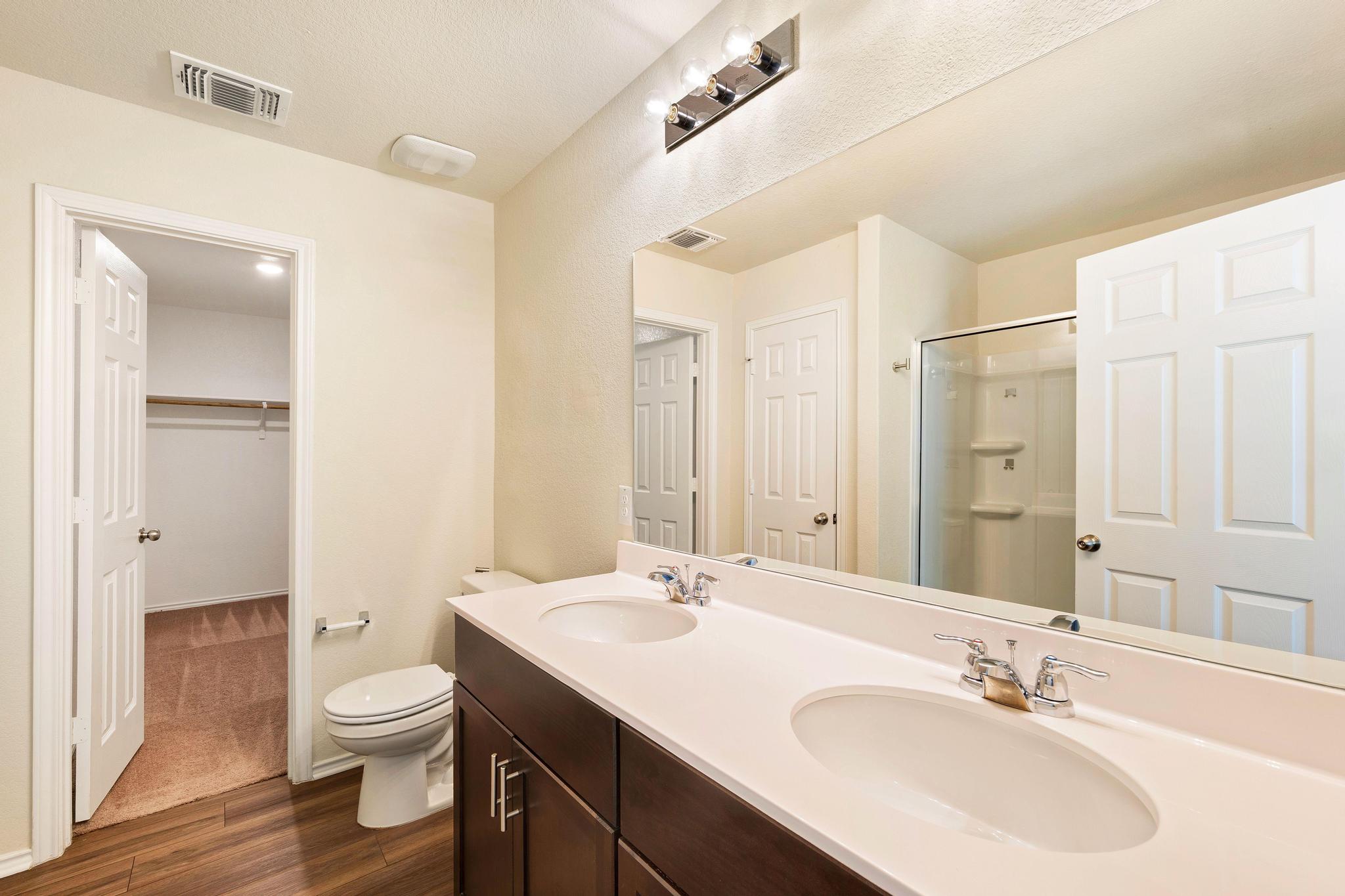 217 Innisfree Road Jarrell, TX 76537 - Photo 24 of 39 Double vanities and modern fixtures define this well-appointed bath.