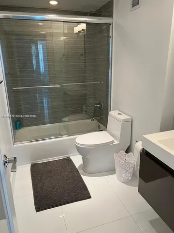 a bathroom with a sink toilet and bathtub