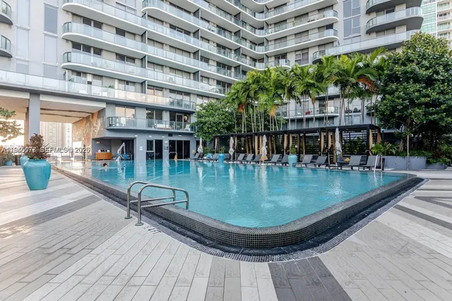 a view of a swimming pool with a lake view