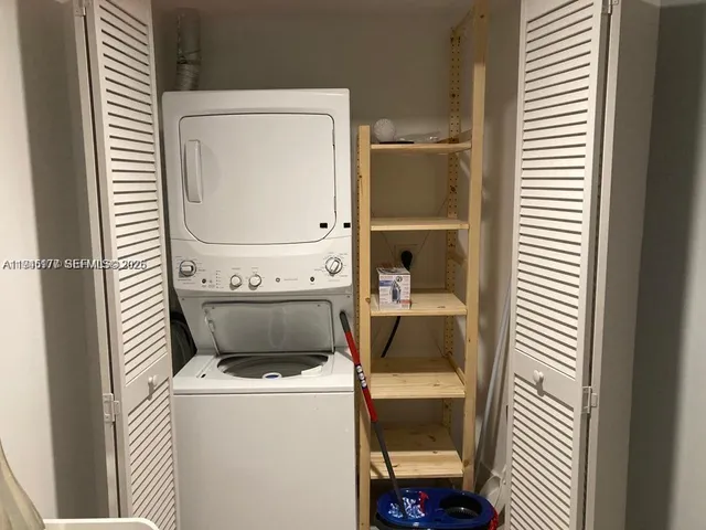 a bathroom with a sink toilet and a mirror