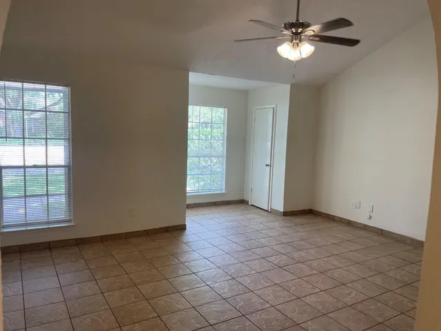 a view of an empty room with a window