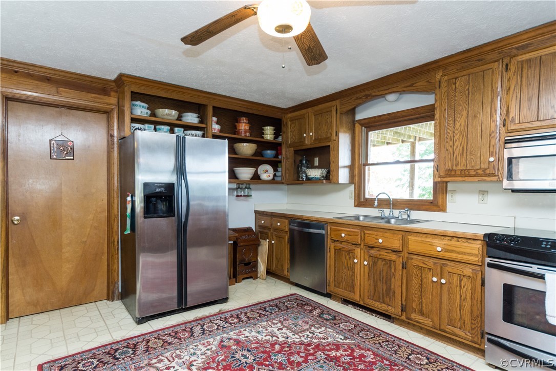 22 Foxes Tract Road West Point, VA 23181 - Photo 14 of 36 a kitchen with stainless steel appliances granite countertop a refrigerator a sink and dishwasher