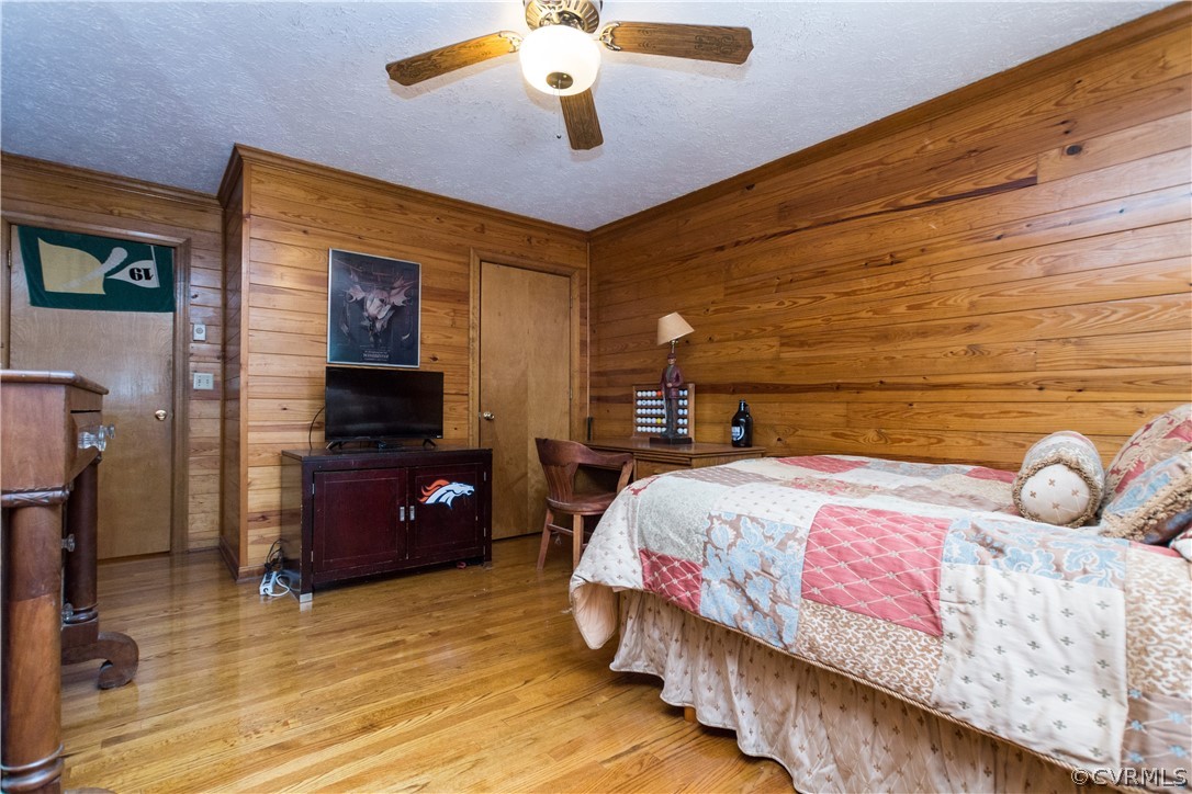 22 Foxes Tract Road West Point, VA 23181 - Photo 22 of 36 a bedroom with a bed and wooden floor
