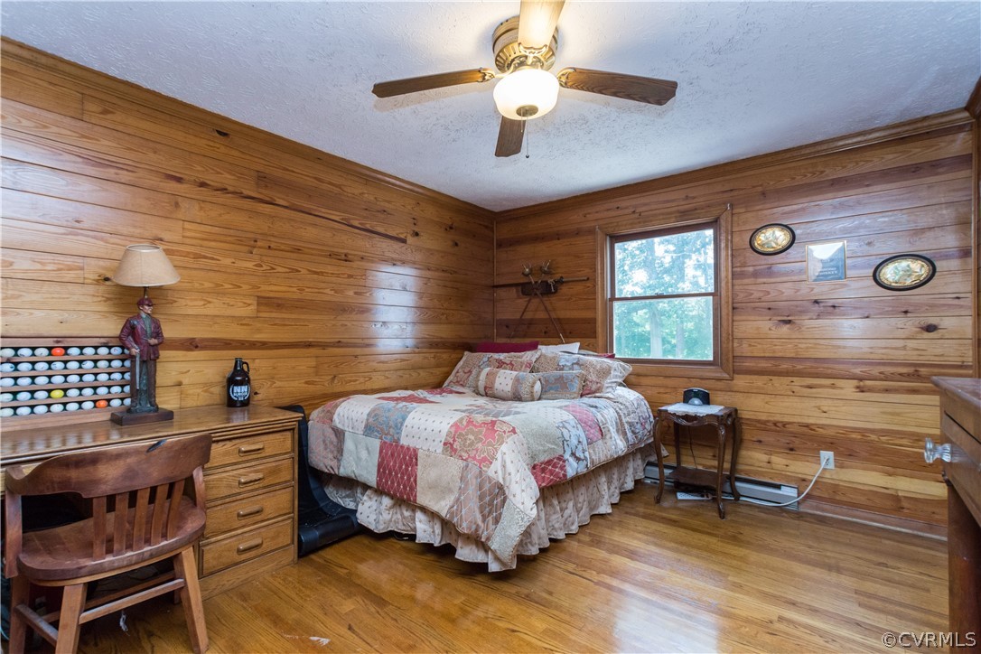 22 Foxes Tract Road West Point, VA 23181 - Photo 23 of 36 a bedroom with a bed and a table