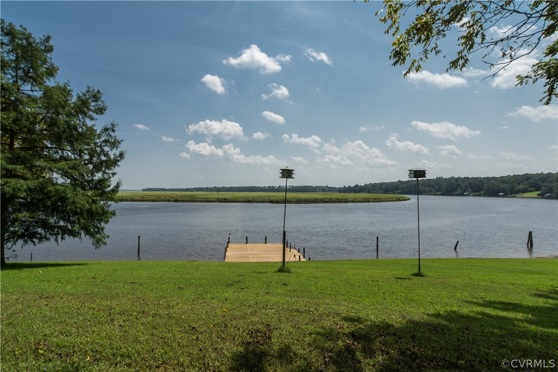 22 Foxes Tract Road West Point, VA 23181 - Photo 26 of 36 a view of a lake and a yard