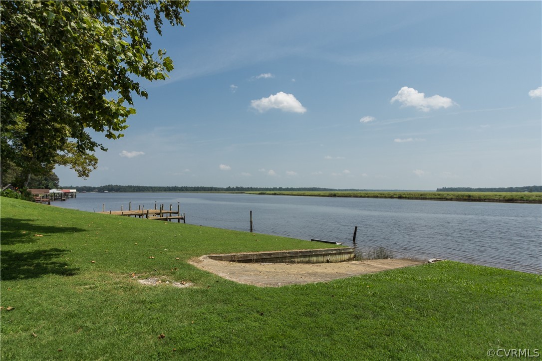 22 Foxes Tract Road West Point, VA 23181 - Photo 28 of 36 a view of a lake with a big yard