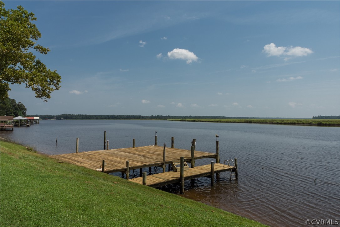22 Foxes Tract Road West Point, VA 23181 - Photo 29 of 36 a view of a lake with outdoor seating space