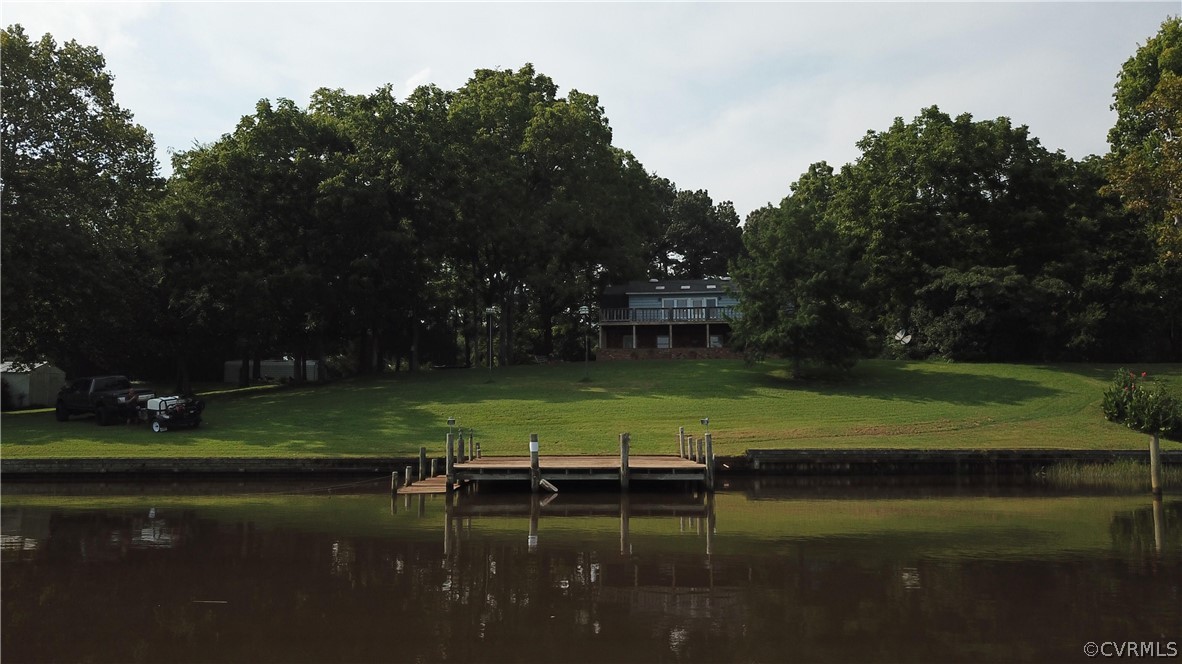 22 Foxes Tract Road West Point, VA 23181 - Photo 33 of 36 a view of a lake with a yard in back