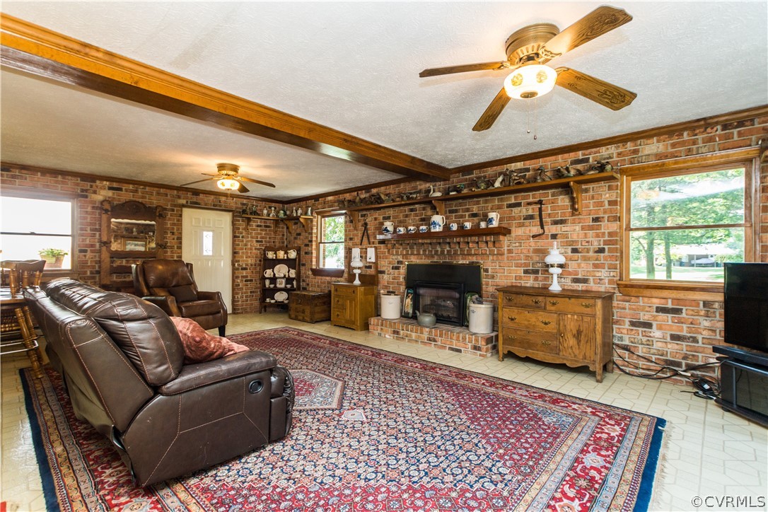 22 Foxes Tract Road West Point, VA 23181 - Photo 7 of 36 a living room with furniture and a fireplace