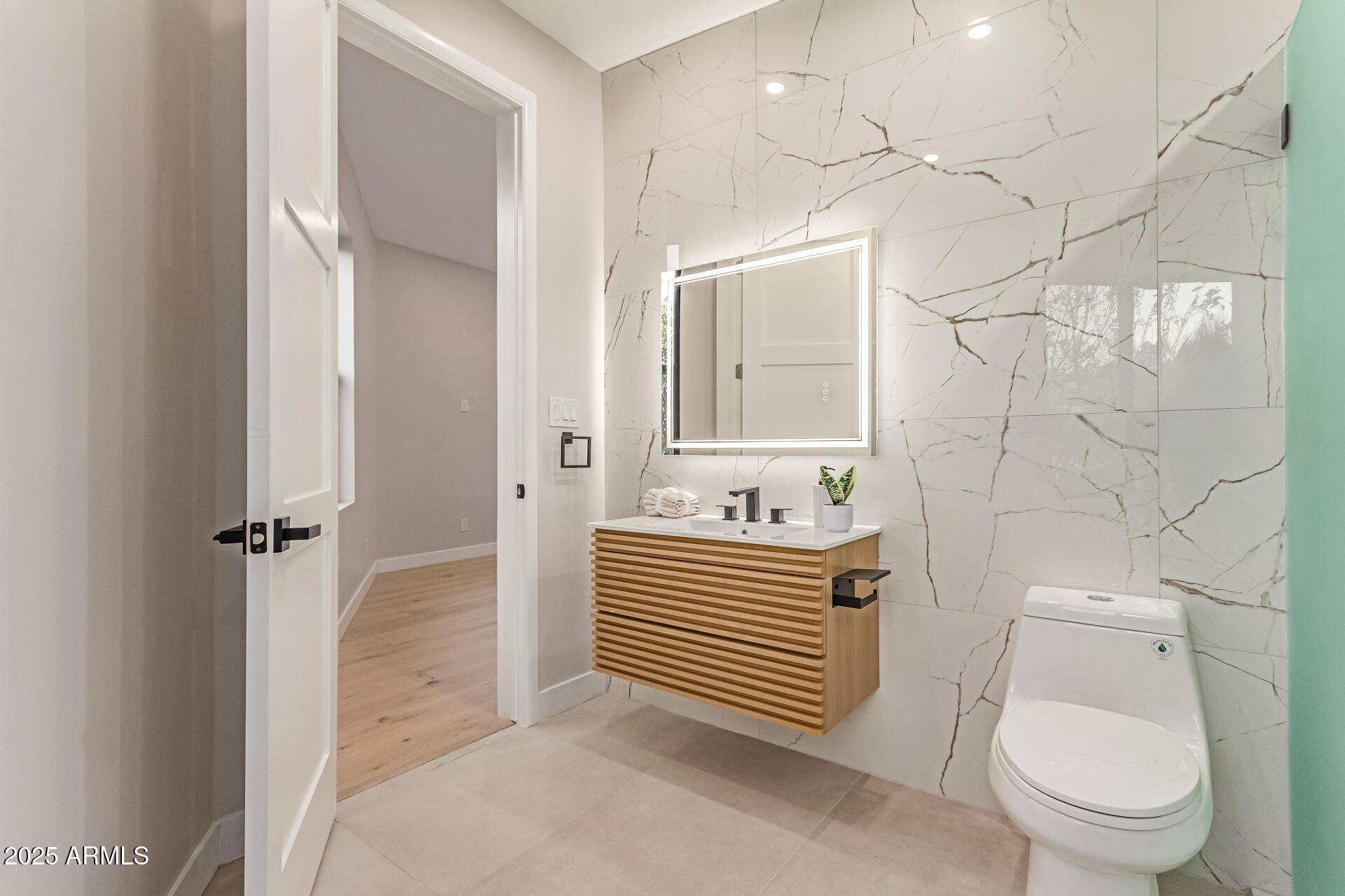 3301 East Rovey Avenue Paradise Valley, AZ 85253 - Photo 69 of 105 a bathroom with a sink a toilet and shower