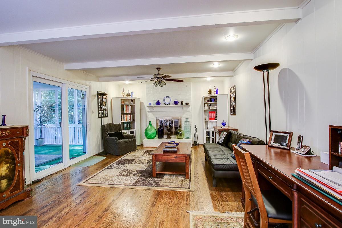 11413 Running Cedar Road Reston, VA 20191 - Photo 10 of 30 Warm Family Room has hardwood floors & FP