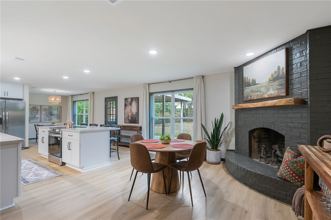 1509 Barak Lane Bryan, TX 77802 - Photo 12 of 24 a living room with furniture a fireplace and a table