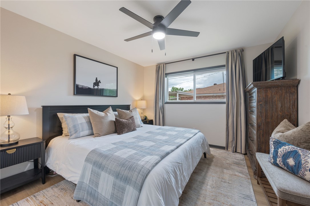 1509 Barak Lane Bryan, TX 77802 - Photo 18 of 24 a bedroom with a large bed and a window