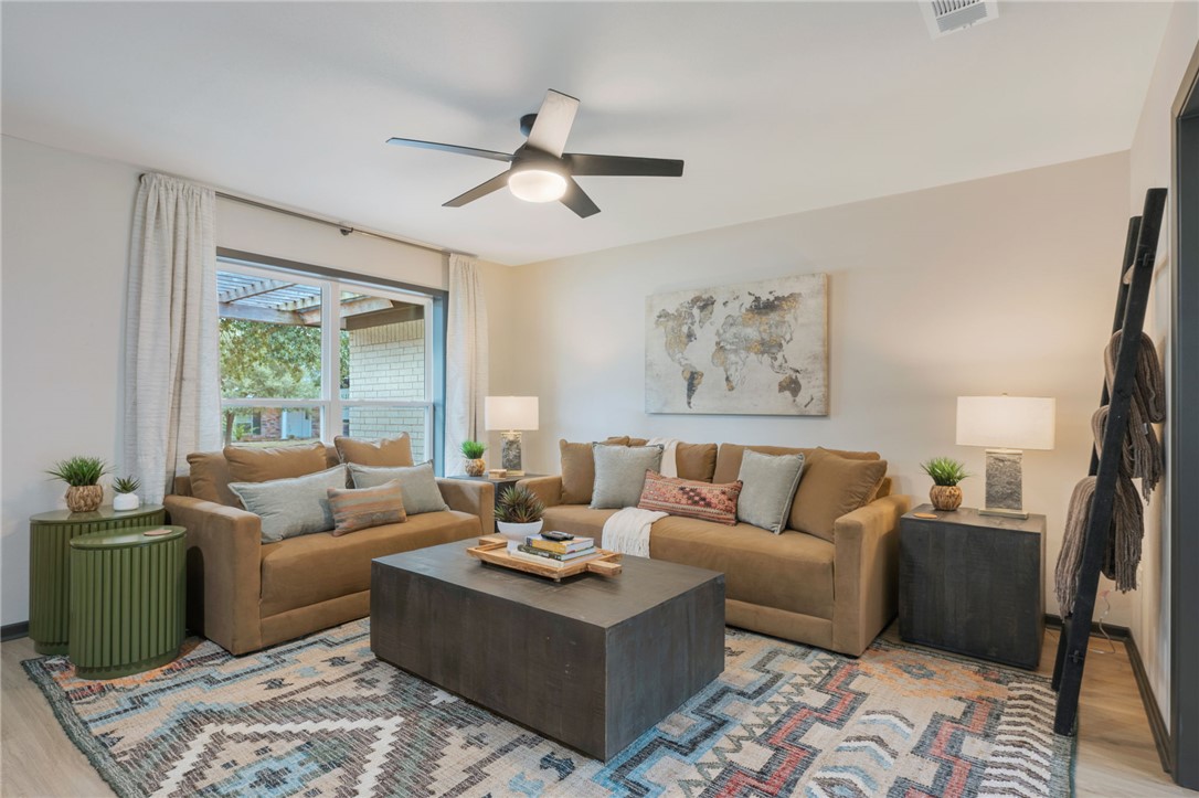 1509 Barak Lane Bryan, TX 77802 - Photo 5 of 24 a living room with furniture and a large window