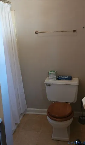 a bathroom with a sink a toilet a mirror and vanity