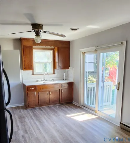 a kitchen with granite countertop a stove and a microwave