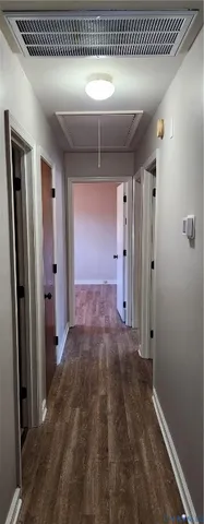 a white toilet sitting next to a shower