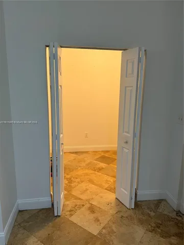 a view of an empty room and window