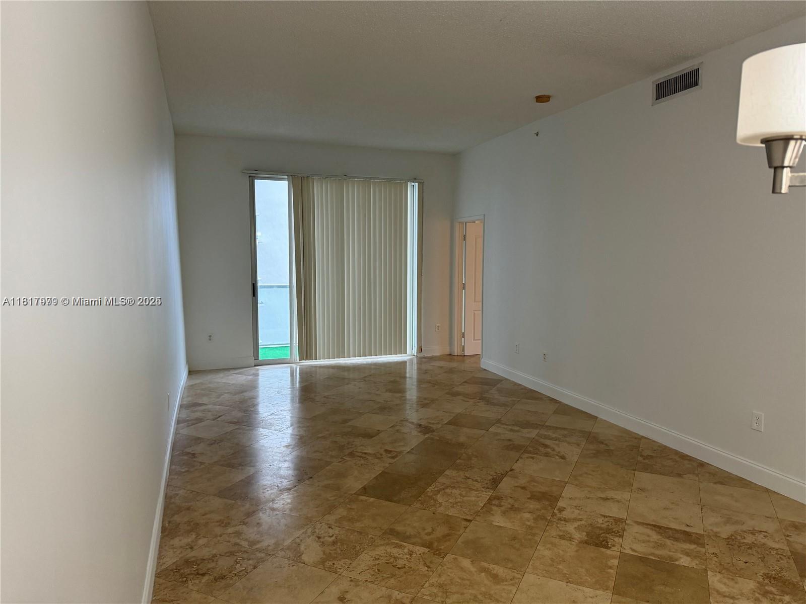 5091 Northwest 7th Street, Unit 615 Miami, FL 33126 - Photo 16 of 40 a view of an empty room and window