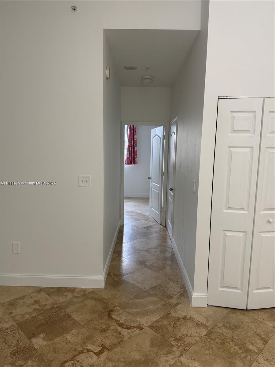 5091 Northwest 7th Street, Unit 615 Miami, FL 33126 - Photo 17 of 40 a view of gallery with hallway