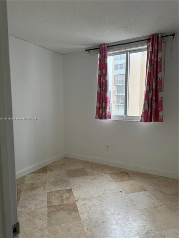 an empty room with closet area