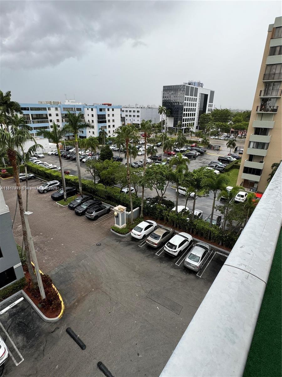 5091 Northwest 7th Street, Unit 615 Miami, FL 33126 - Photo 38 of 40 a view of a terrace with sitting area