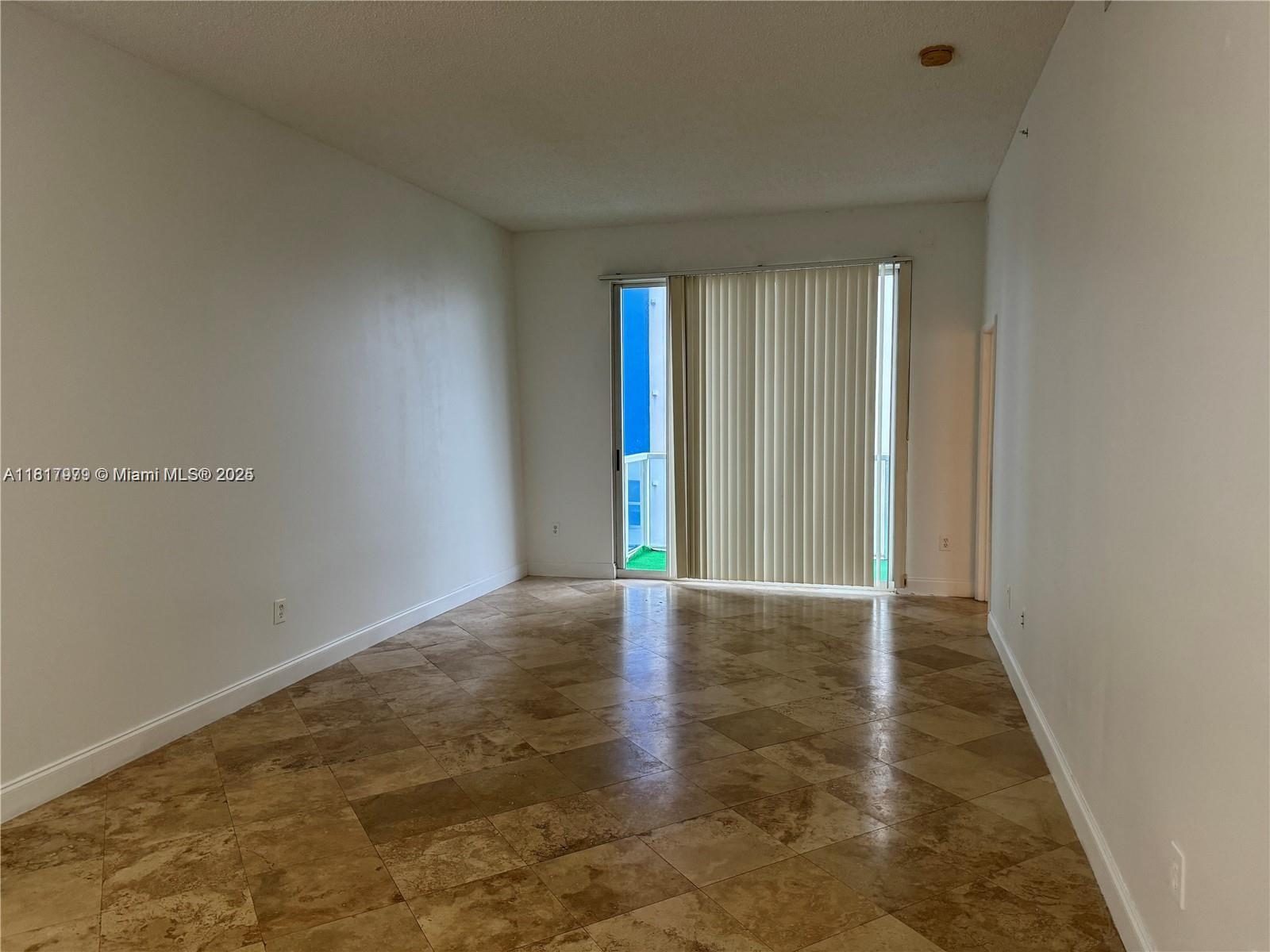 5091 Northwest 7th Street, Unit 615 Miami, FL 33126 - Photo 7 of 40 a view of an empty room