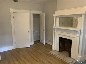 a view of hallway with wooden floor