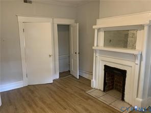 3119 A 4th Avenue Richmond, VA 23222 - Photo 12 of 15 a view of an empty room with wooden floor and a window