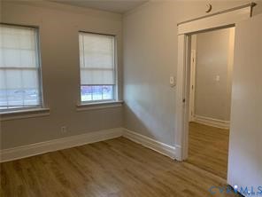 3119 A 4th Avenue Richmond, VA 23222 - Photo 13 of 15 an empty room with wooden floor and windows