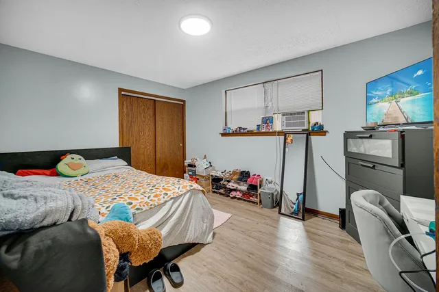 a bedroom with a bed and furniture