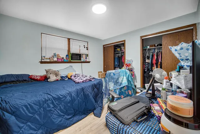 a bed room with a bed and a couch