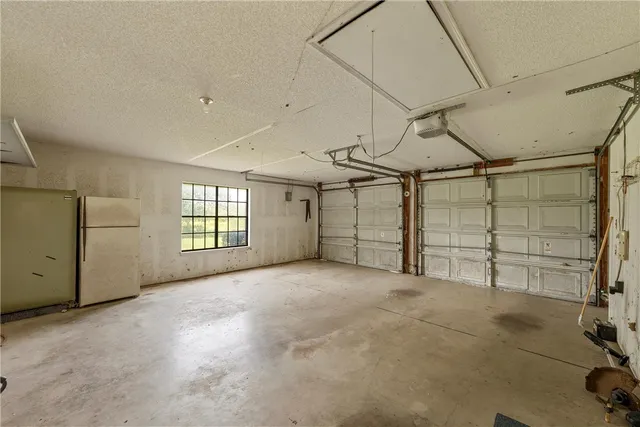 a kitchen with a table and chairs