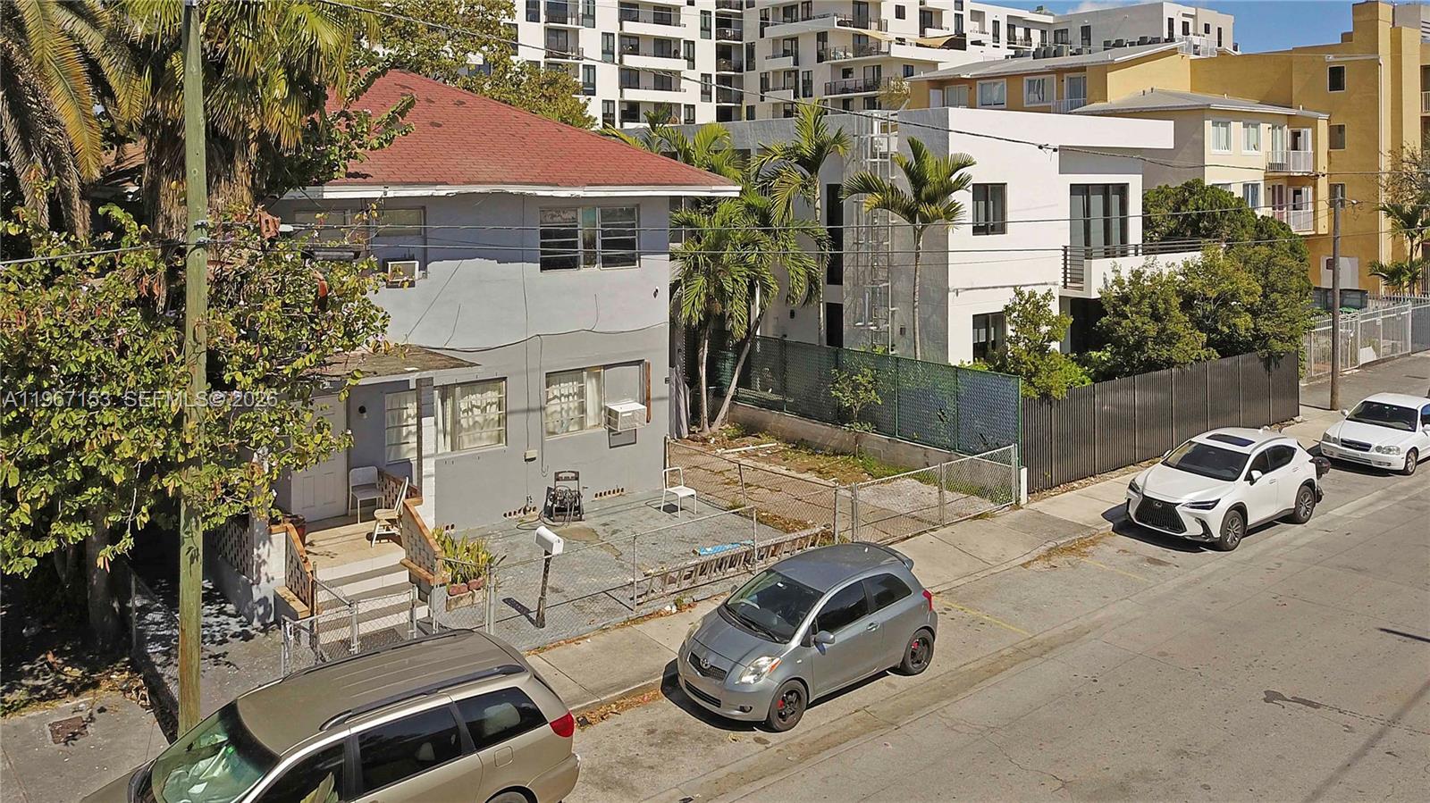 767 Southwest 2nd Street Miami, FL 33130 - Photo 2 of 22 a view of a patio with table and chairs and potted plants