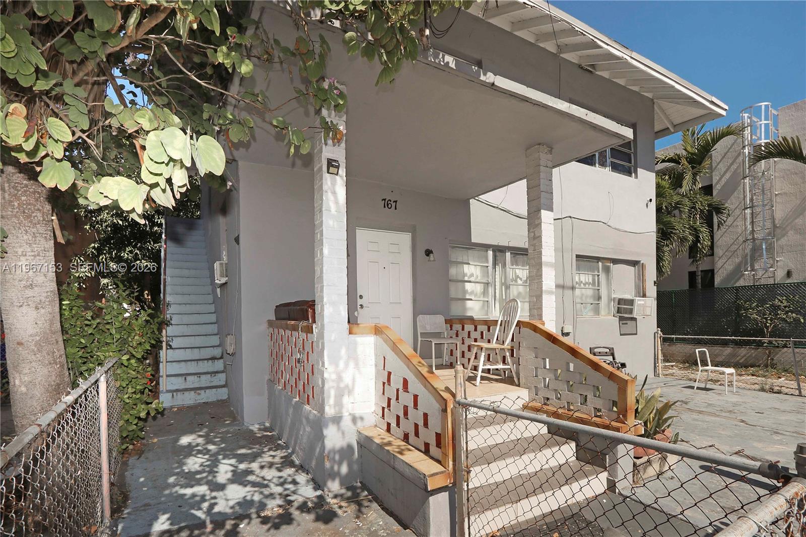 767 Southwest 2nd Street Miami, FL 33130 - Photo 5 of 22 a view of balcony with wooden floor and fence