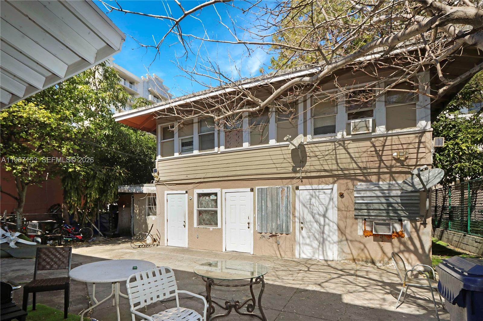 767 Southwest 2nd Street Miami, FL 33130 - Photo 9 of 22 a view of a patio with table and chairs and potted plants