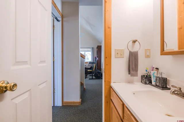 a bathroom with a sink vanity and a mirror