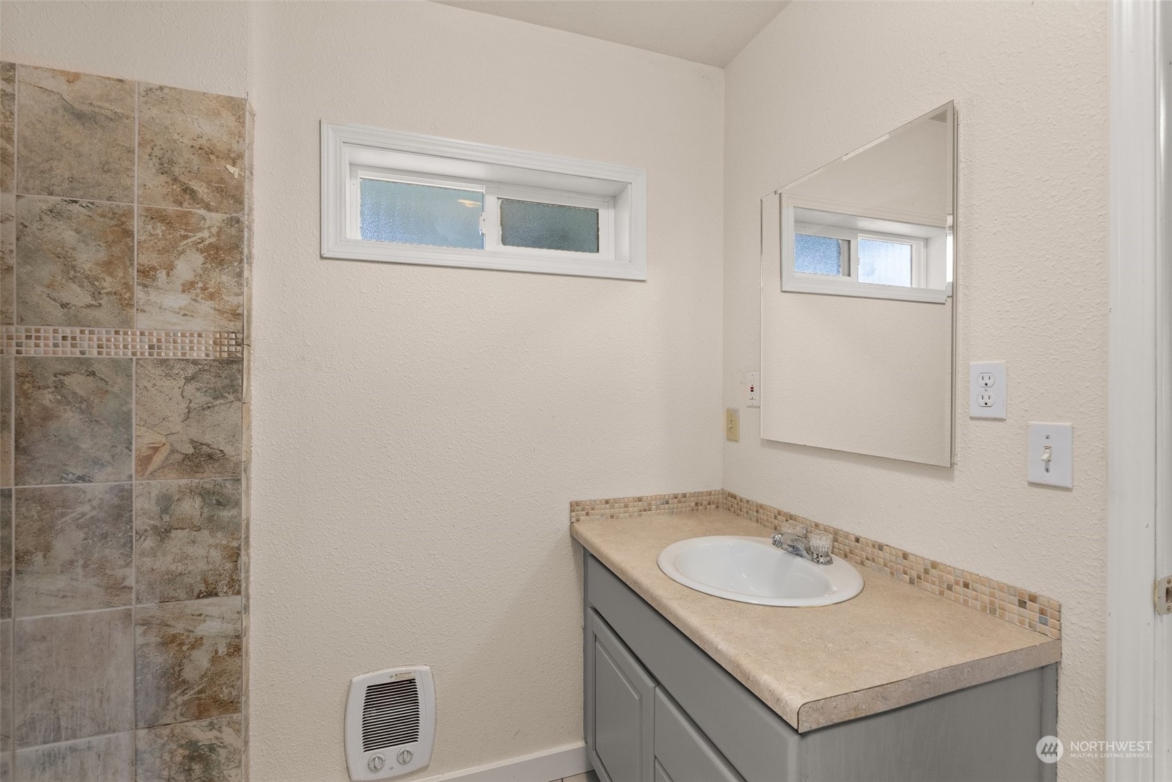 2131 Stuart Street Raymond, WA 98577 - Photo 13 of 25 a bathroom with a sink and a mirror