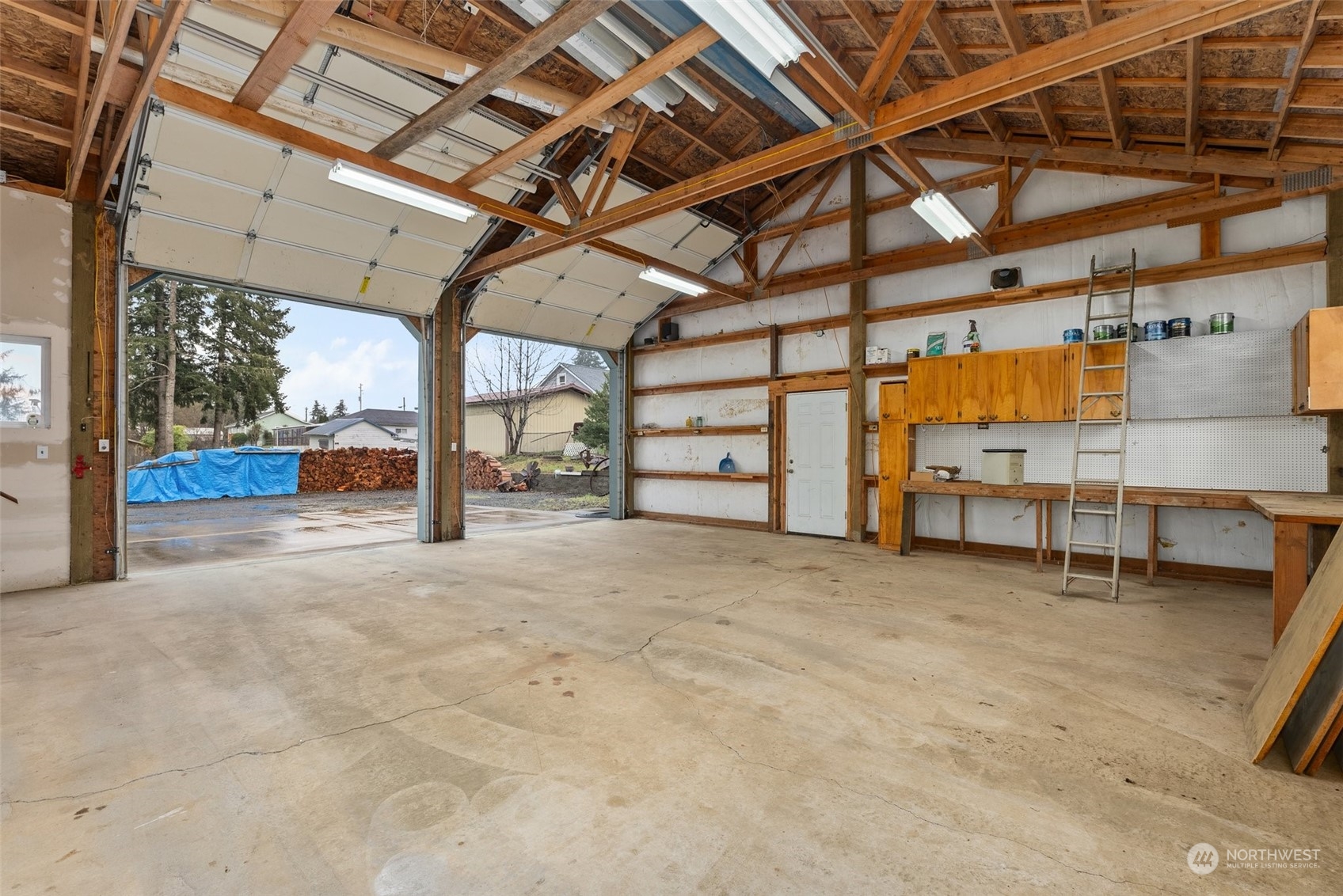 2131 Stuart Street Raymond, WA 98577 - Photo 15 of 25 a view of a empty room with wooden ceiling