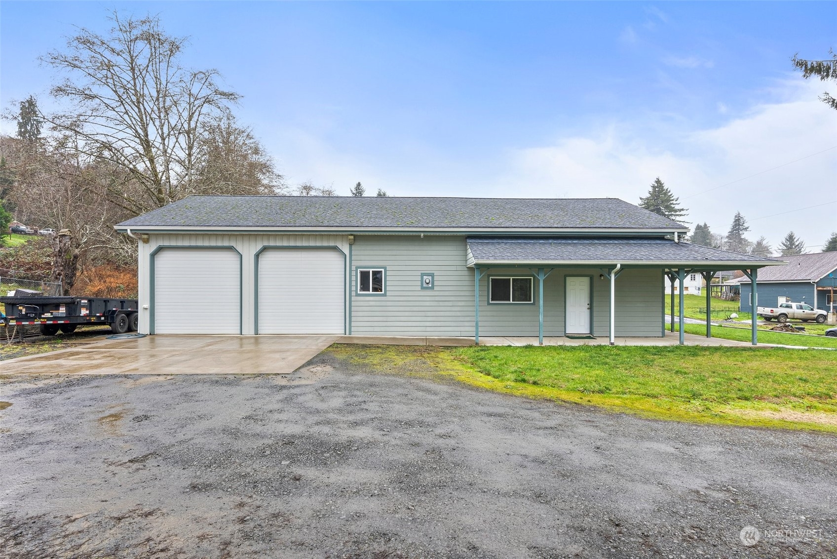 2131 Stuart Street Raymond, WA 98577 - Photo 2 of 25 a front view of a house with a yard and garage