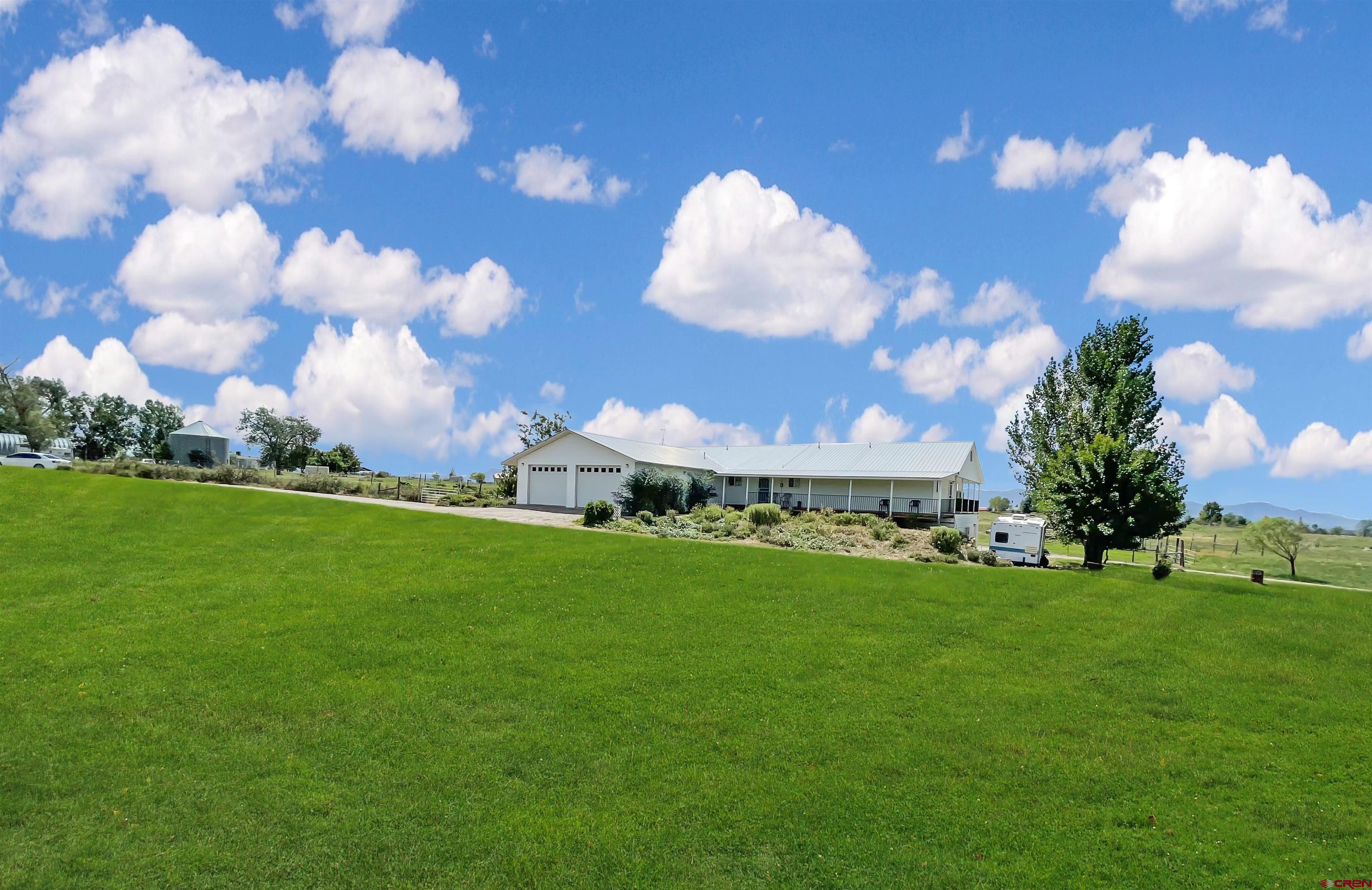 25970 Rd P Cortez, CO 81321 - Photo 2 of 20 a view of a big yard with large trees