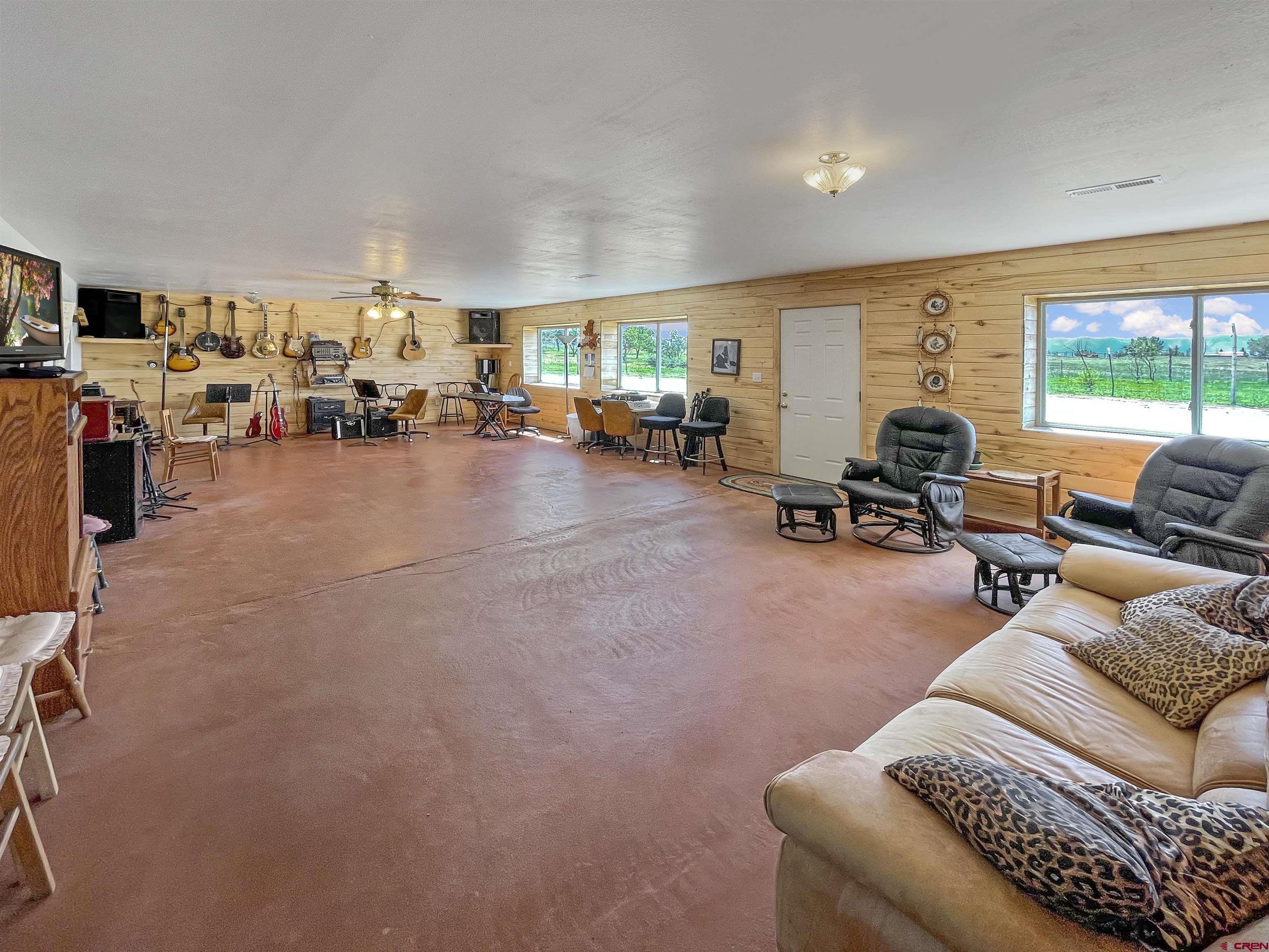 25970 Rd P Cortez, CO 81321 - Photo 15 of 20 a living room with furniture and a large window