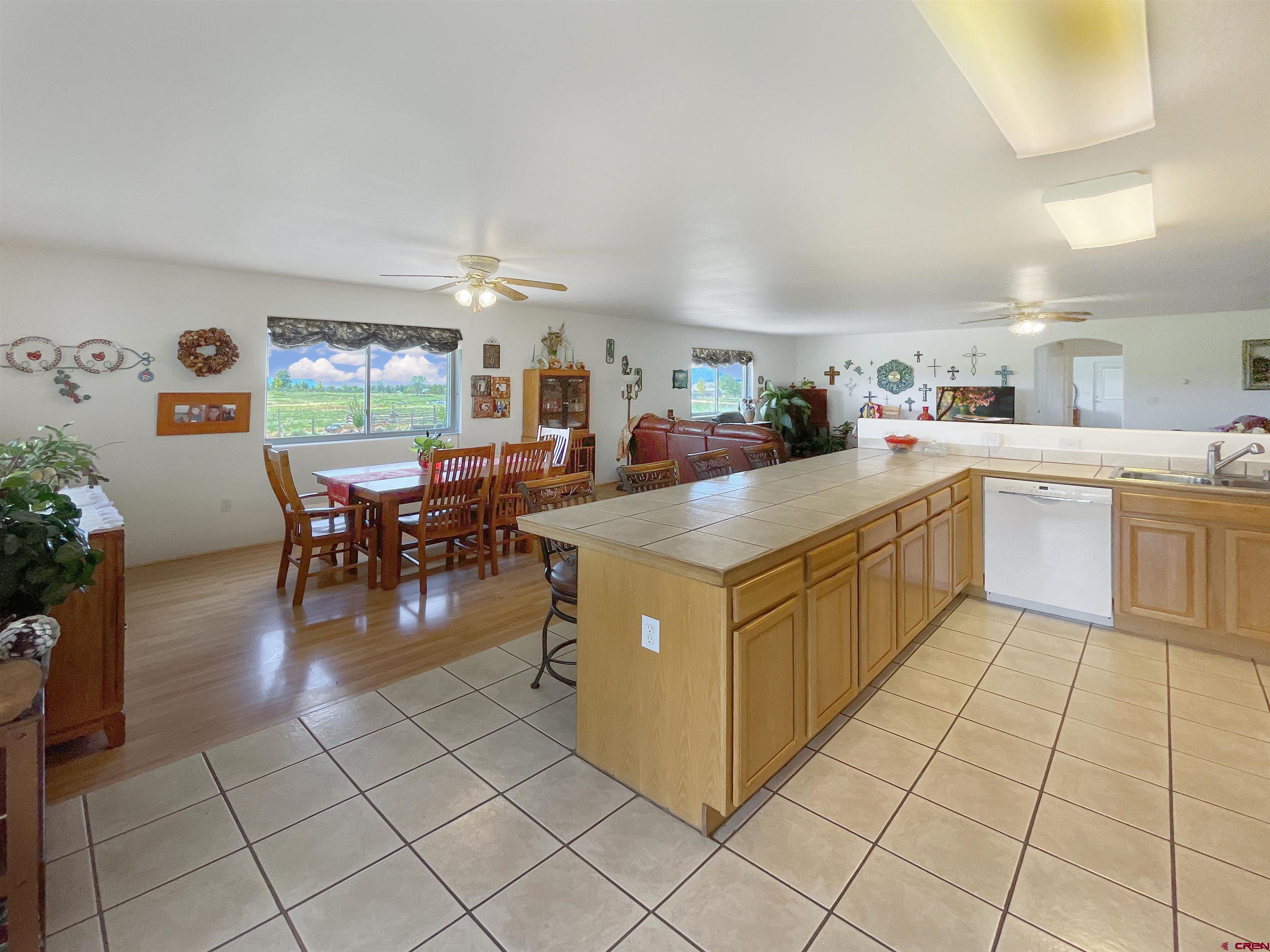 25970 Rd P Cortez, CO 81321 - Photo 5 of 20 a kitchen with stainless steel appliances granite countertop a stove and cabinets