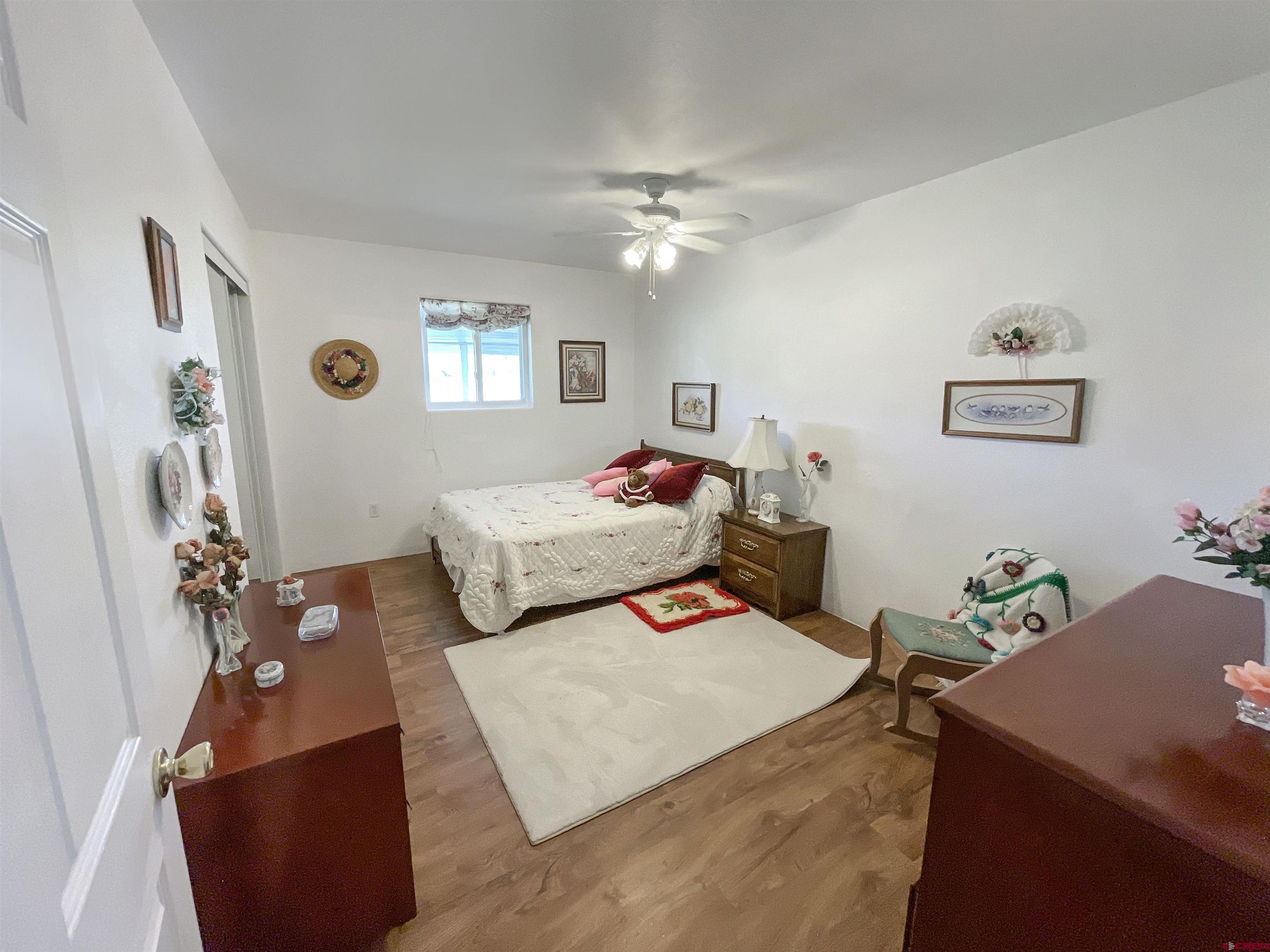 25970 Rd P Cortez, CO 81321 - Photo 10 of 20 a bedroom with a bed and a table