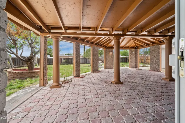a view of an empty room with a fireplace